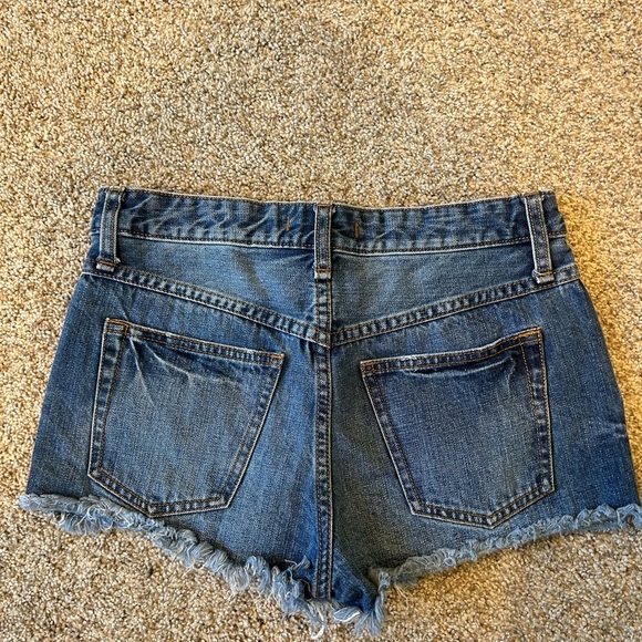 Free People short cut off Jean shorts. 2” inseam. Stretch. Medium wash. Raw hem - Picture 4 of 8